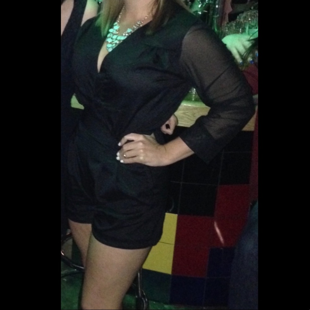Black fitted romper with sheer sleeves